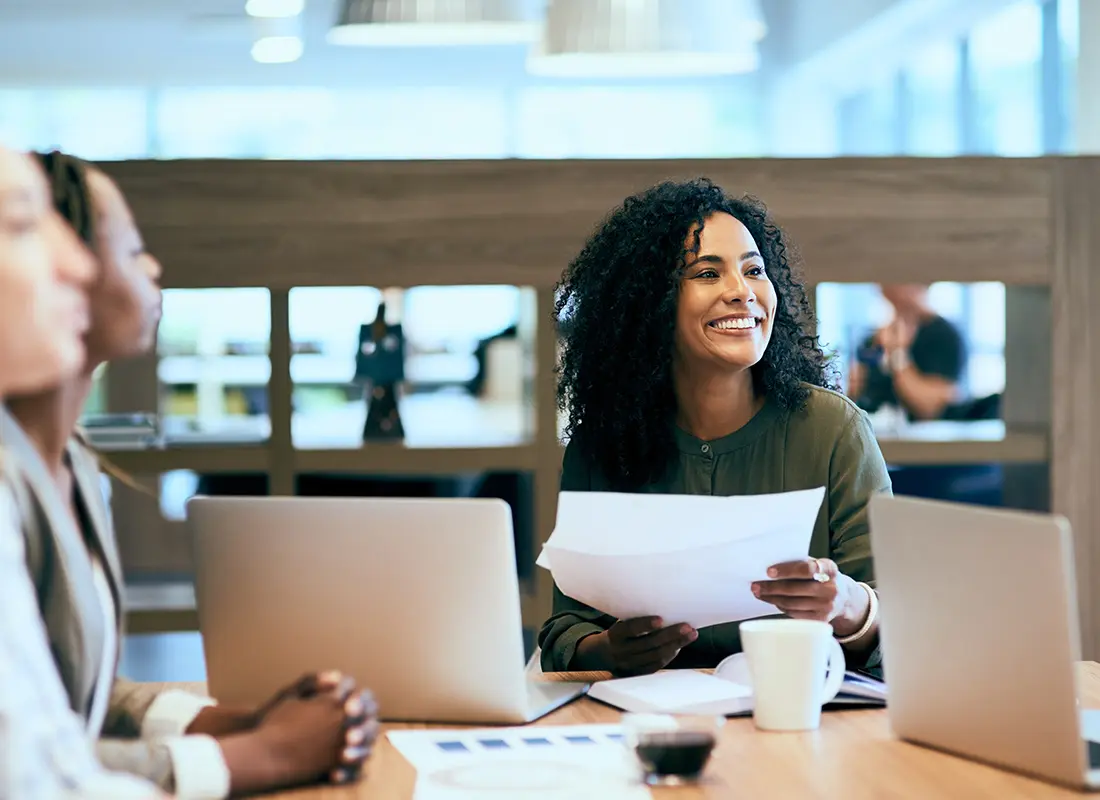 About-Our-Agency-Business-Woman-Smiling-in-Meeting